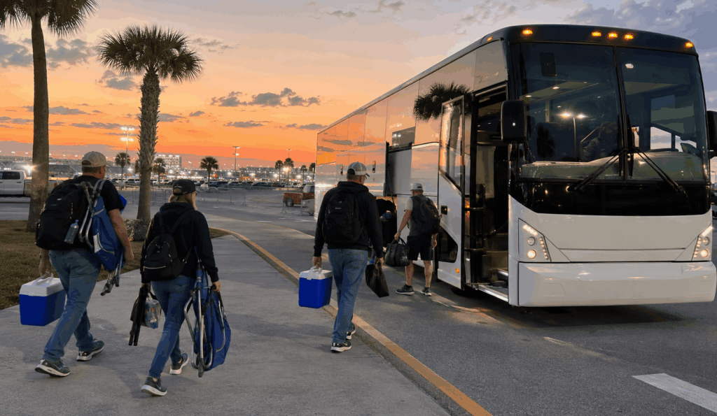 charter bus picking up daytona 500 fans outside a downtown jacksonville hotel for a group trip to daytona international speedway