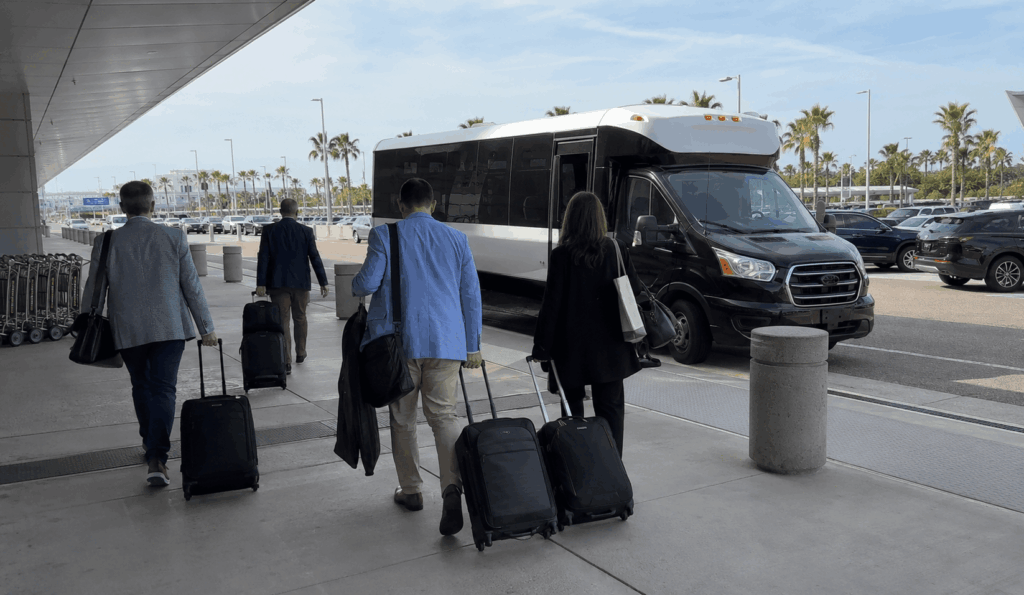 convention guests boarding a shuttle outside a downtown jacksonville hotel for prime osborn convention center