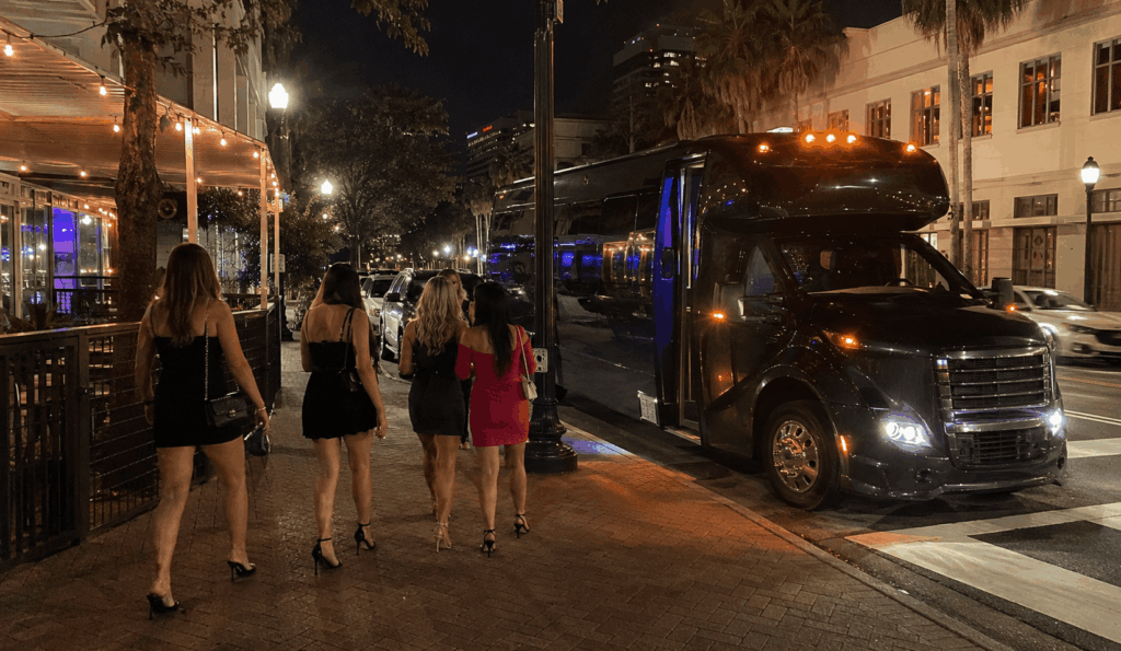 bachelorette group boarding a party bus near riverside nightlife in jacksonville