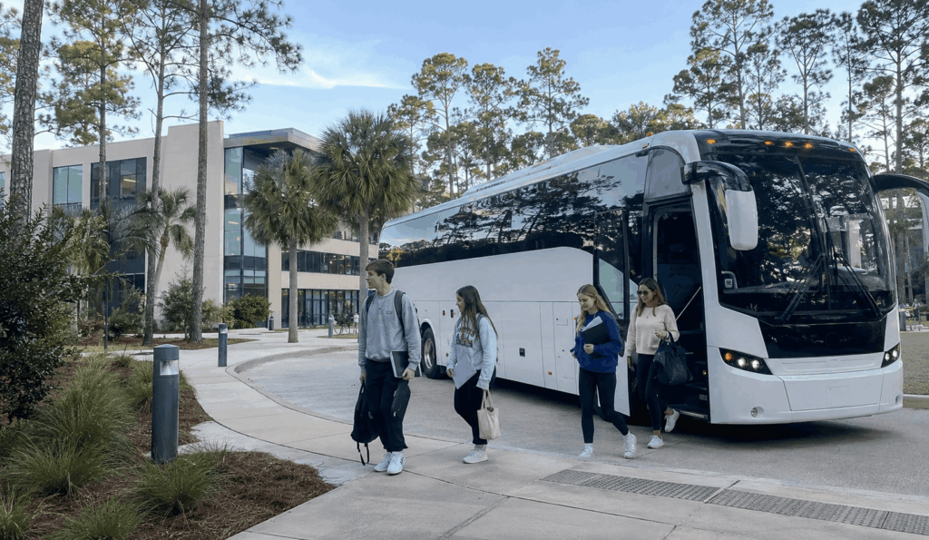 charter bus dropping off students for a college campus tour at unf in jacksonville