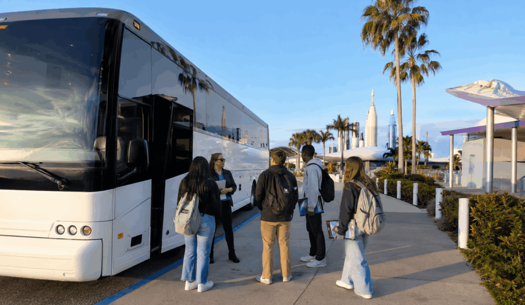 charter bus dropping off jacksonville students at kennedy space center visitor complex for a stem field trip
