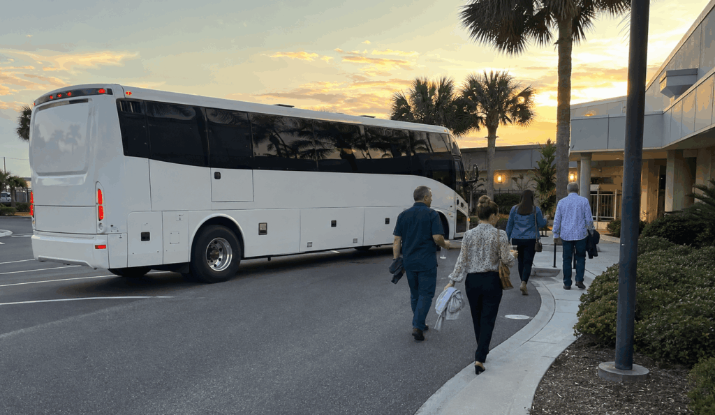 charter bus dropping off concertgoers near ponte vedra concert hall for an evening show