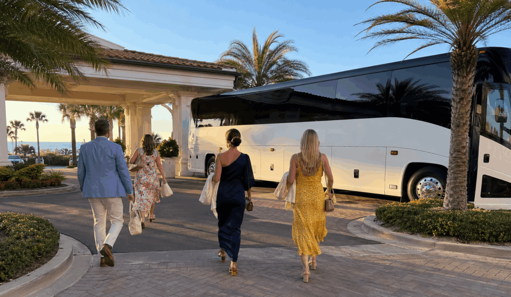 charter bus dropping off wedding guests near ponte vedra inn & club for an oceanfront wedding