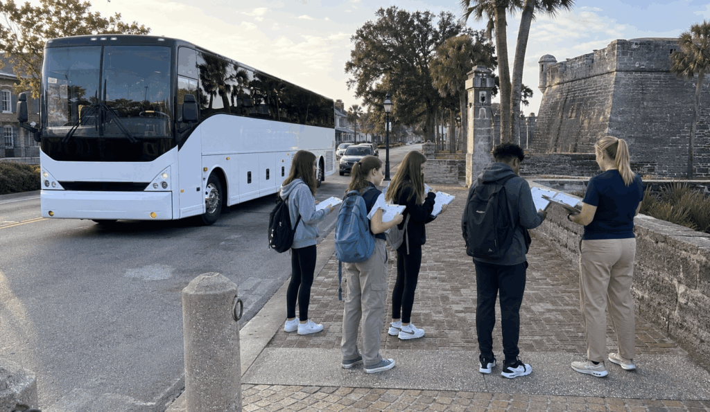 charter bus dropping off students near castillo de san marcos for a st. augustine field trip from jacksonville